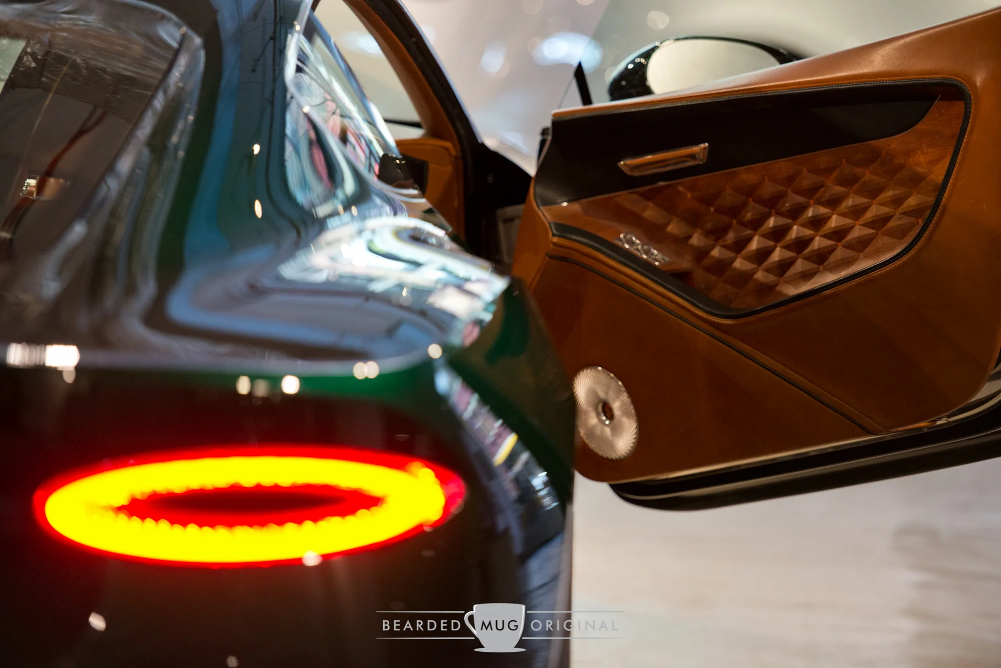 Like an Aston Martin, the doors cant upward oh so delicately when open.