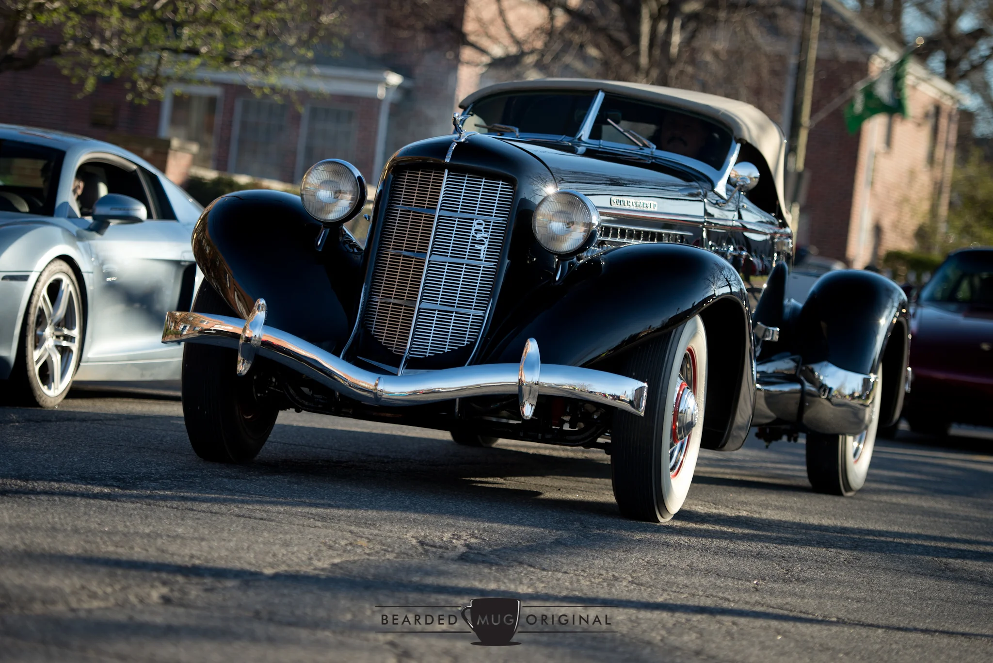 I mean, where else can you see a 1935 Auburn Speedster 851 SC rubbing elbows with a modern Audi R8?
