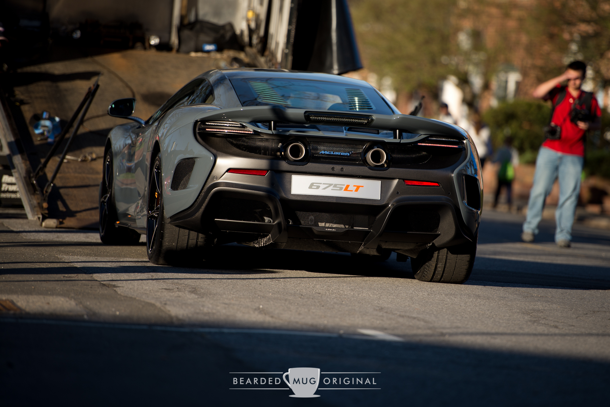 McLaren's limited-production 675 LT is being off-loaded to an awaiting crowd of one eager photographer.