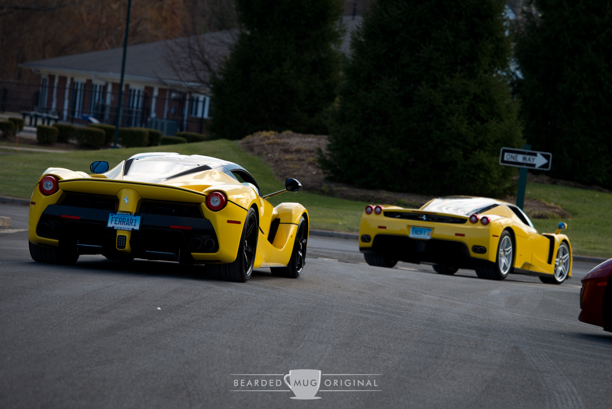 Talk about evolution. An Enzo leads the LaFerrari out of the lot after a successful morning of shooting the promotional picture for the event.