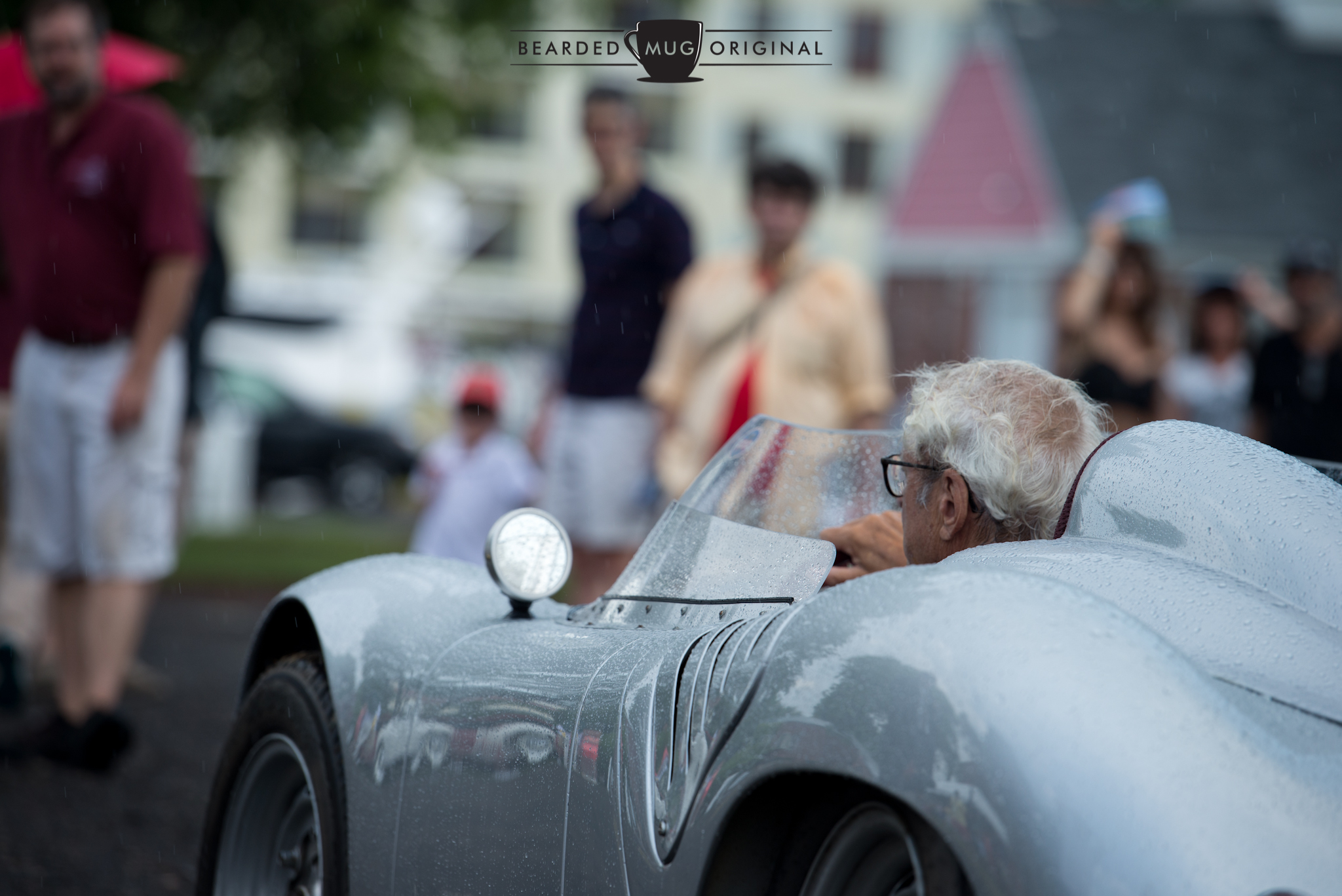 Although it rained during the Concours International awards portion, that did not deter most of the cars from crossing the podium, tops in place or not.