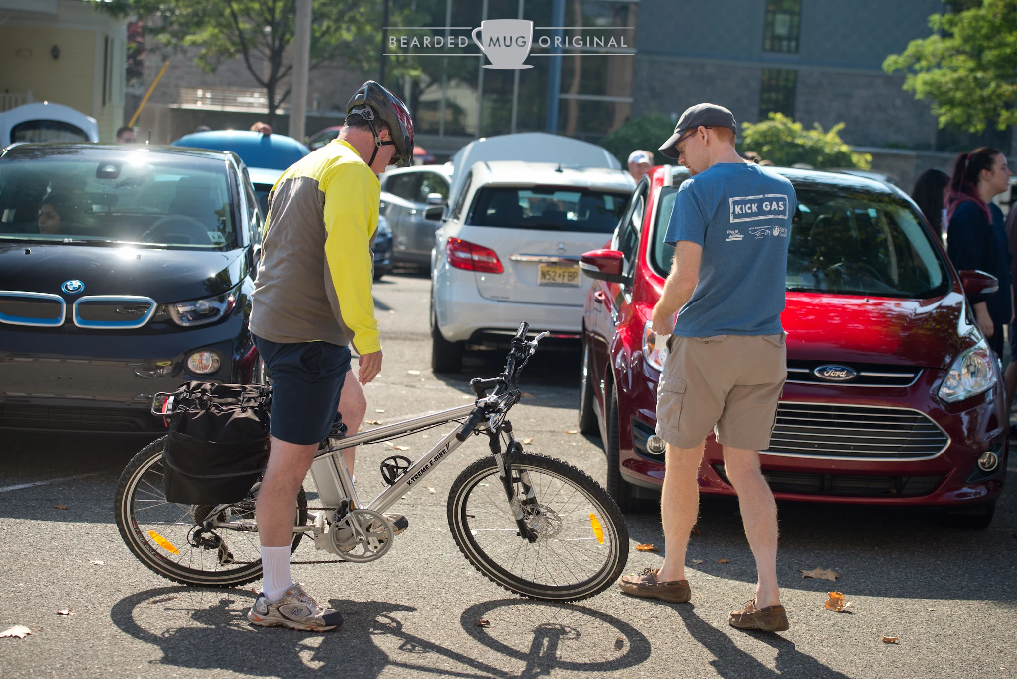 Alex Brown chats with a passing cyclist, who happened to be riding an electric bicycle.