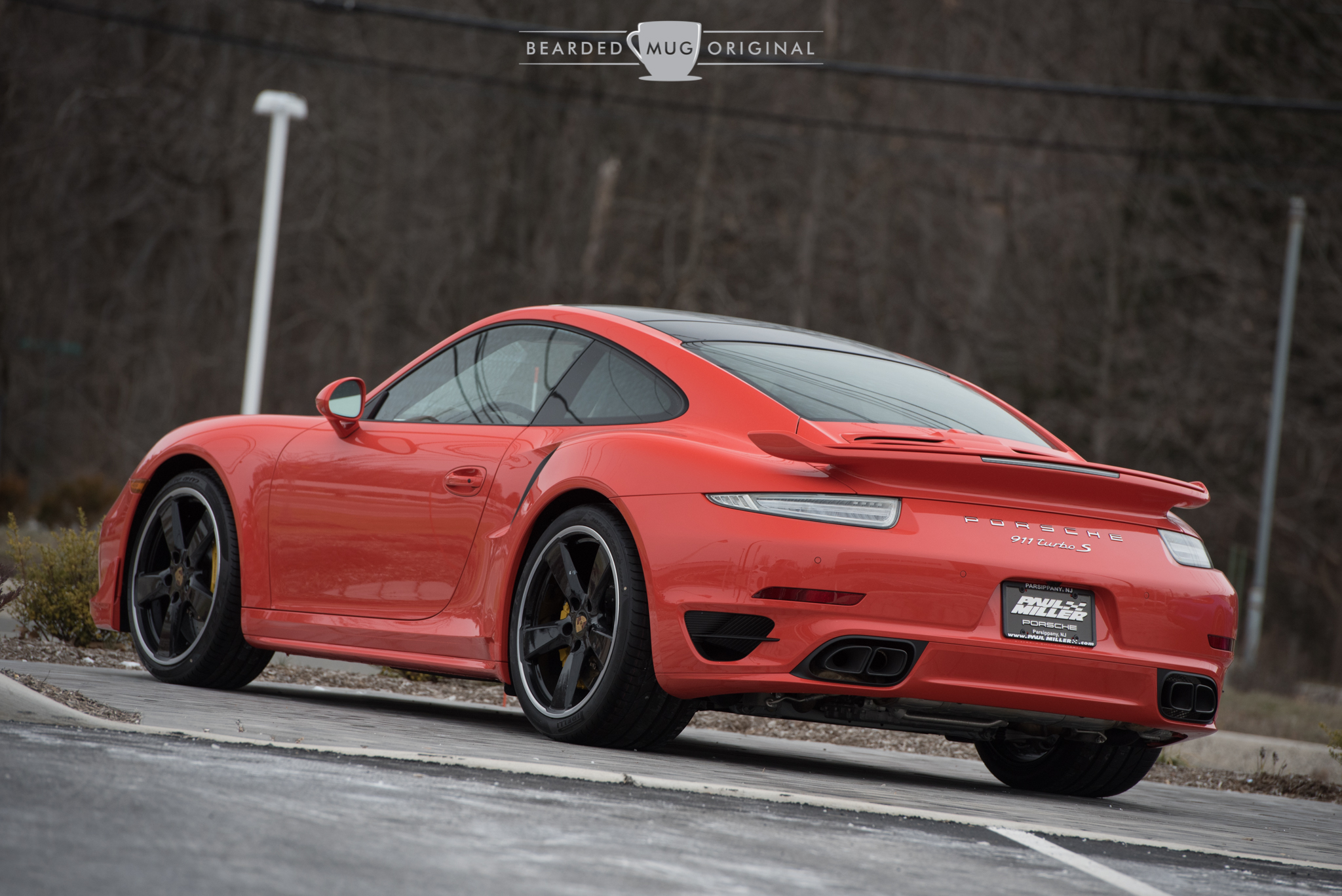 This Lava Orange 991 Turbo is outfitted with a grocery list of extras, including (but not limited to) gloss black wheels and sport mirrors, the aero kit and the glass sunroof. Finding an scantly optioned Porsche is like finding that proverbial needle.