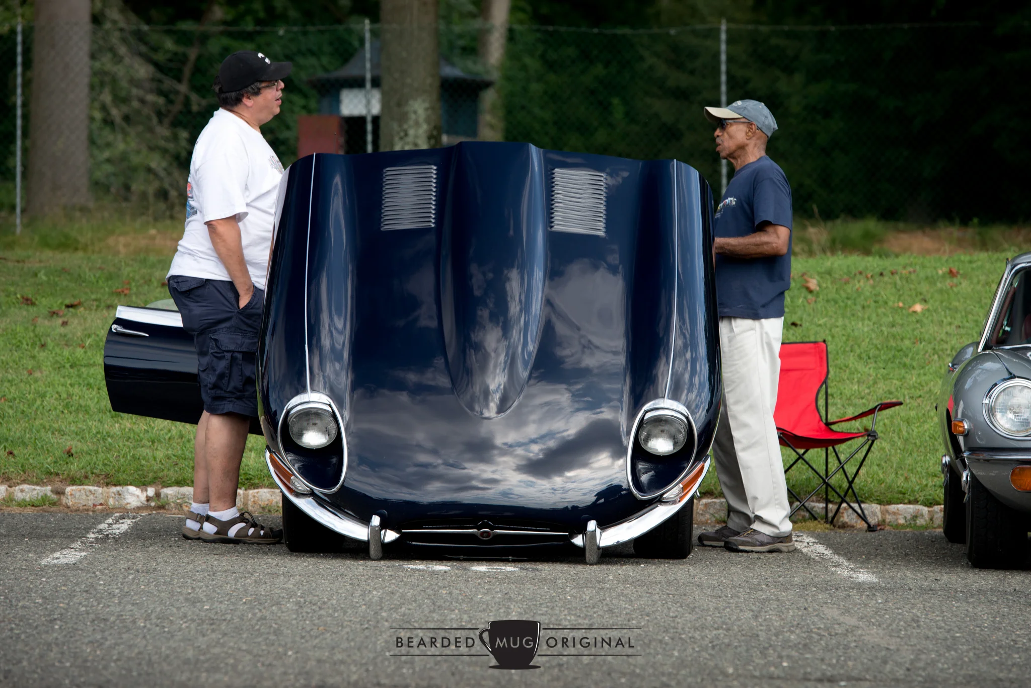George (r.), a regular at the many local C&amp;Cs, is happy to answer questions about his E-Type whenever a query is posed.