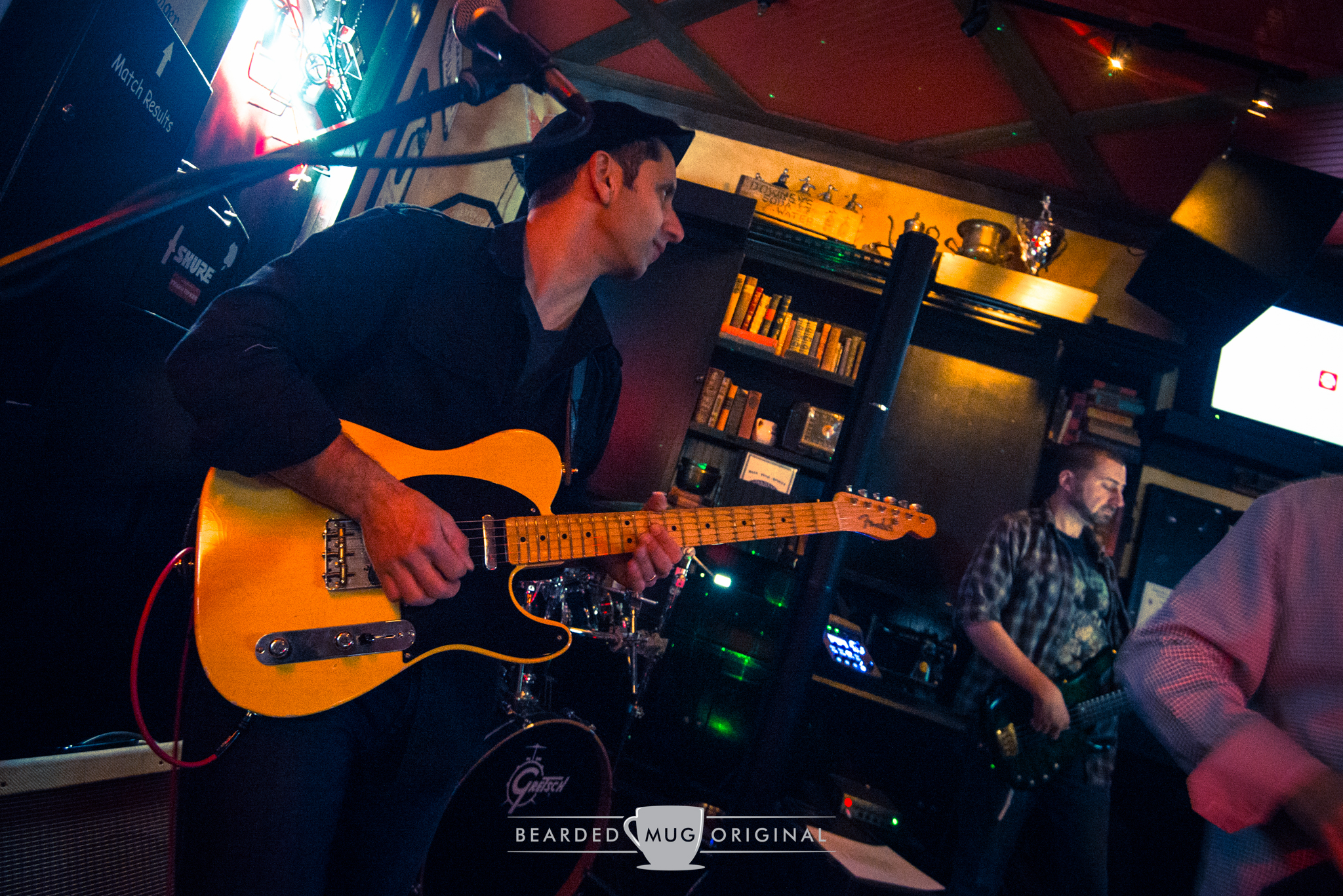 Talent with the string strumming as guitarist Chris pauses during a song.