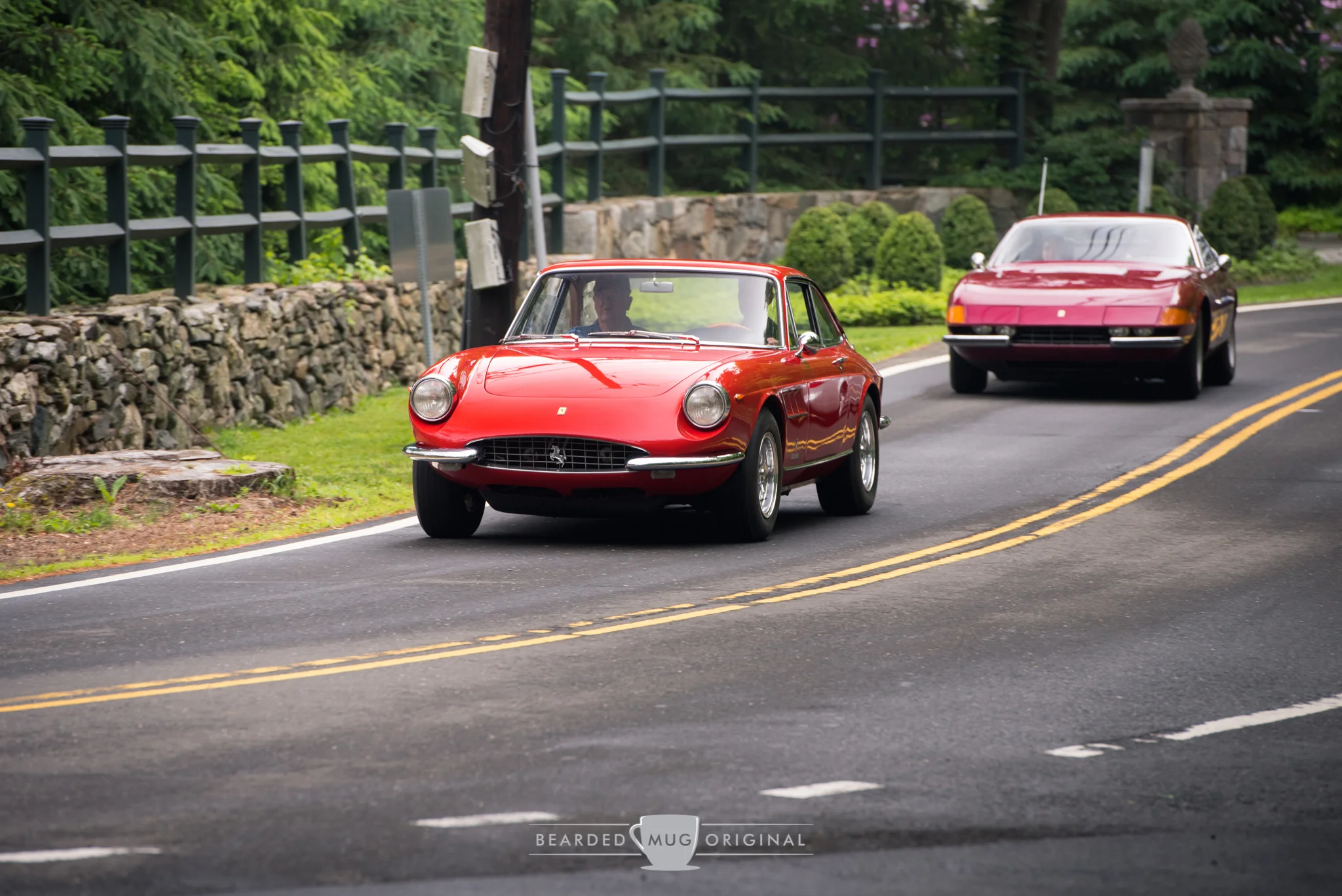 Two Ferraris dancing on the apex.