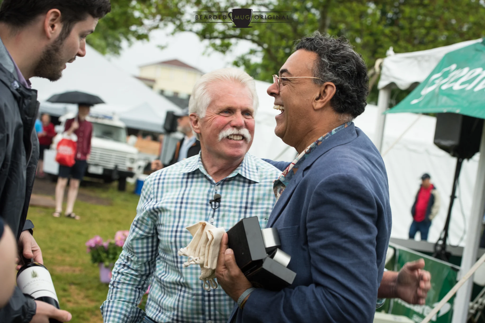 Grand Marshal Wayne Carini congratulates Nick Grewal in winning the Best in Show for Concours International. Nick's 1936 Brough Superior Drophead also claimed the Best in Class in the Prewar division.