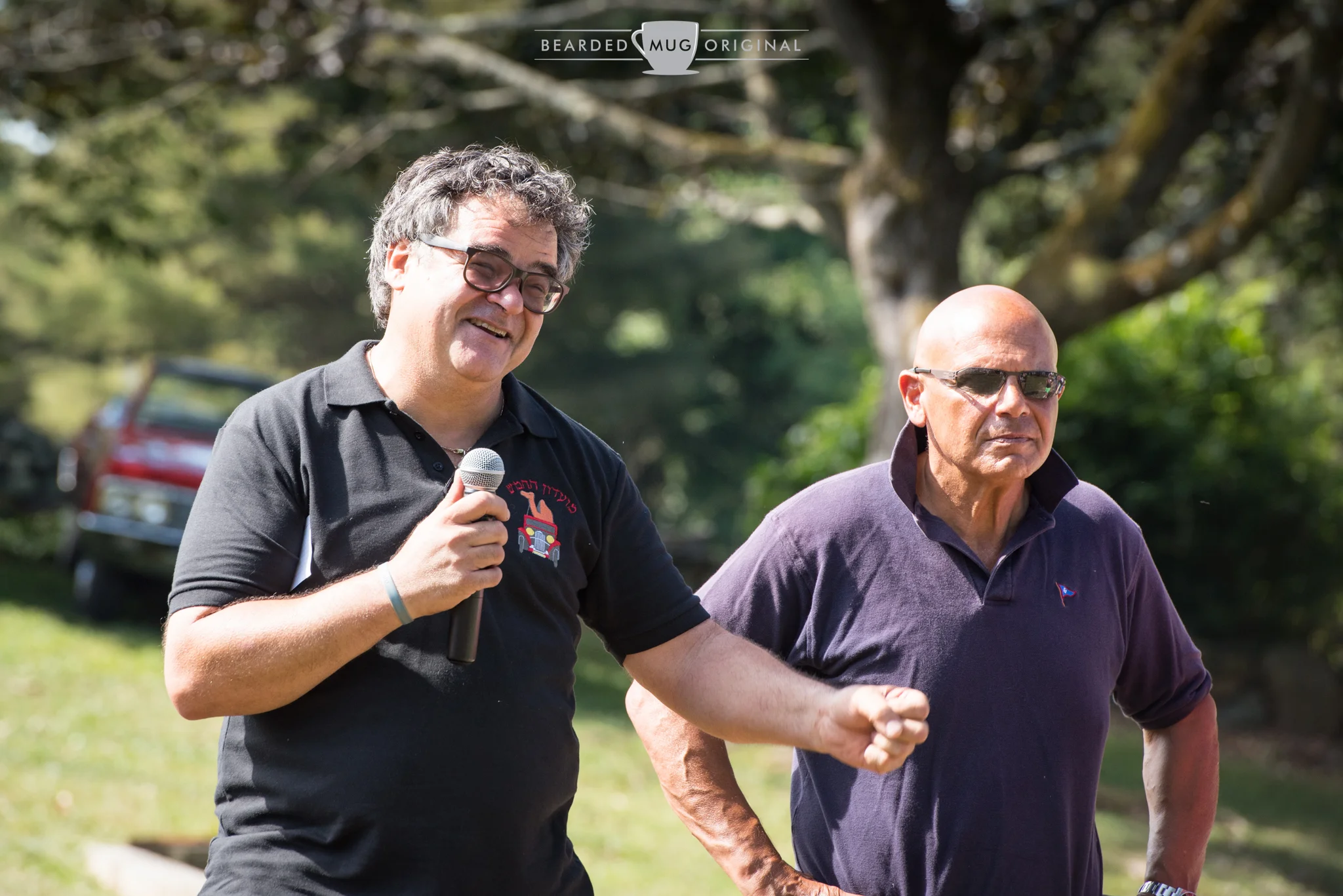 Santo Spadaro, son of Domenico and possessor of one of the friendliest faces, addresses the crowd of over 350 before the cars set off on their journey. Next to him is Mike Bruno, who has played an invaluable role in the Memorial Drive over the years.
