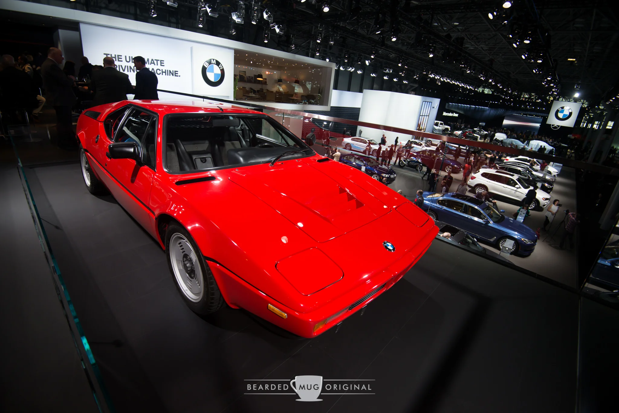 Iconic BMW M1 is on display high above the marque's floorspace. 