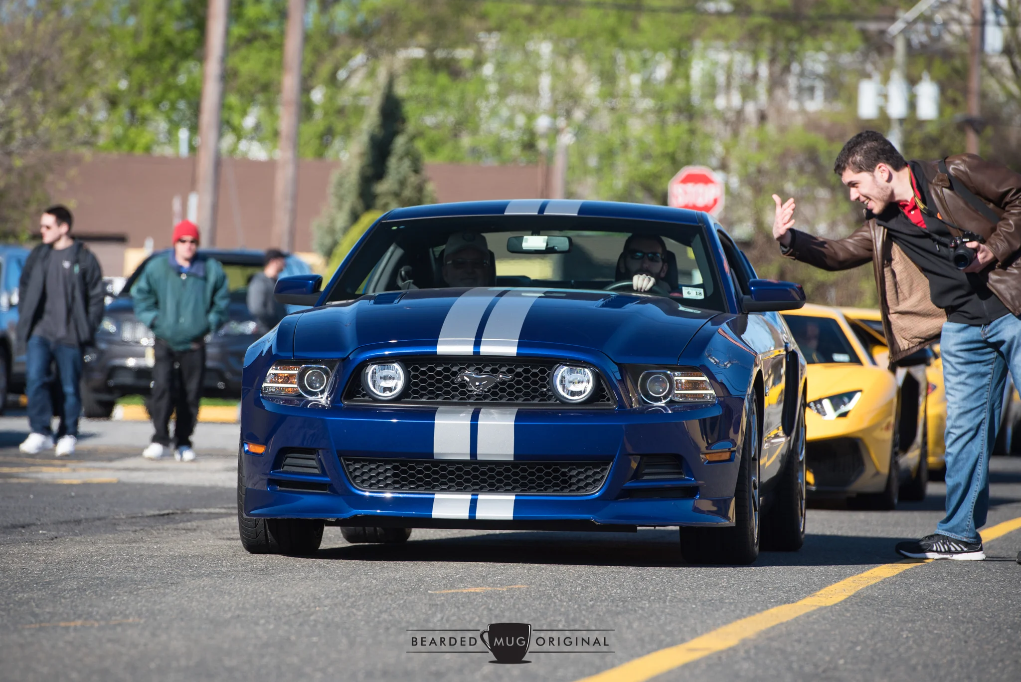 Tony Boniello, the founder of Bergen County Cars & Caffe, can be seen shooing a Mustang along shortly before he slipped into an Aventador SV and drove off into the...parking lot.