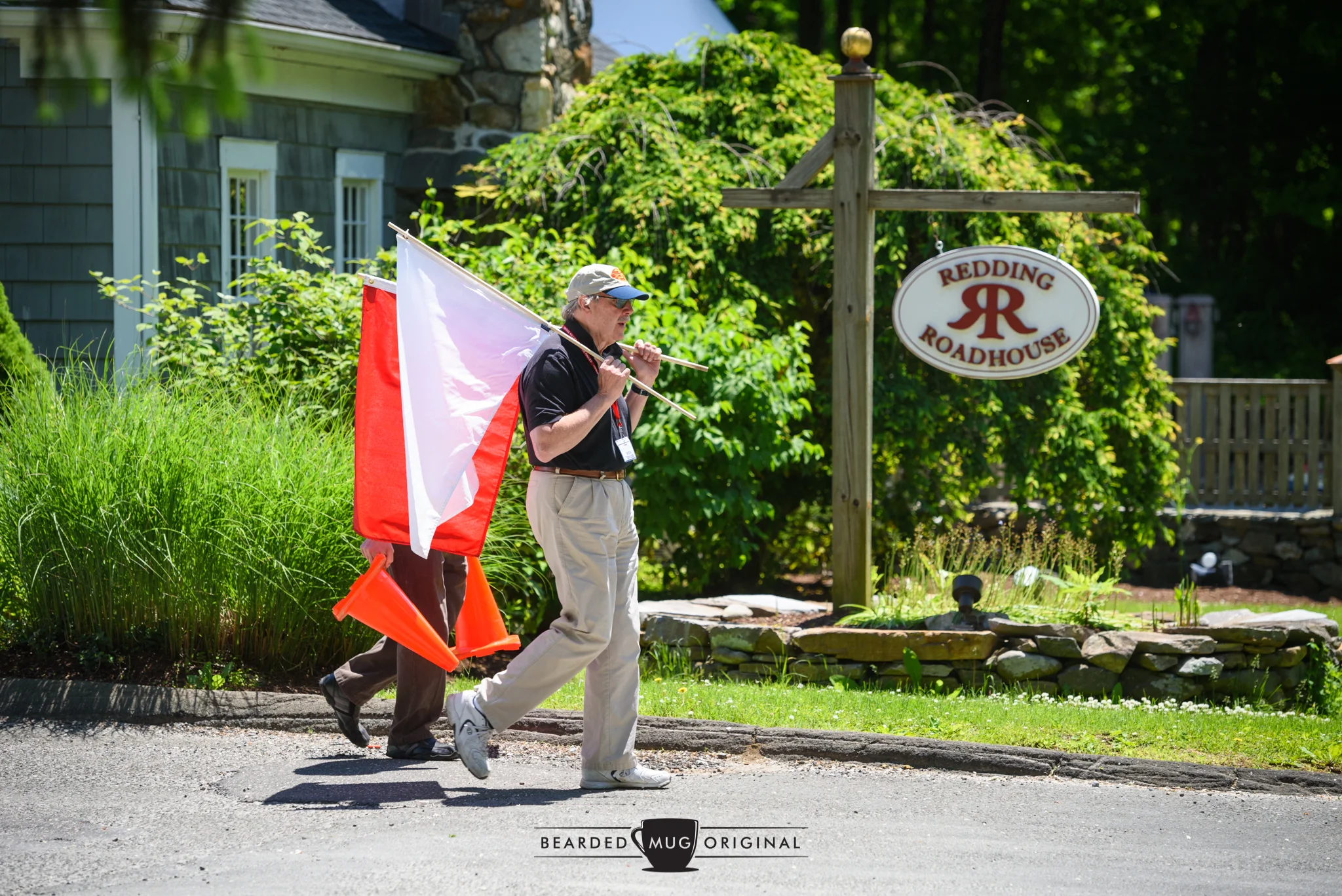 Rich Taylor, of Vintage Rallies, readies the flags to alert the drivers of the chow stop.