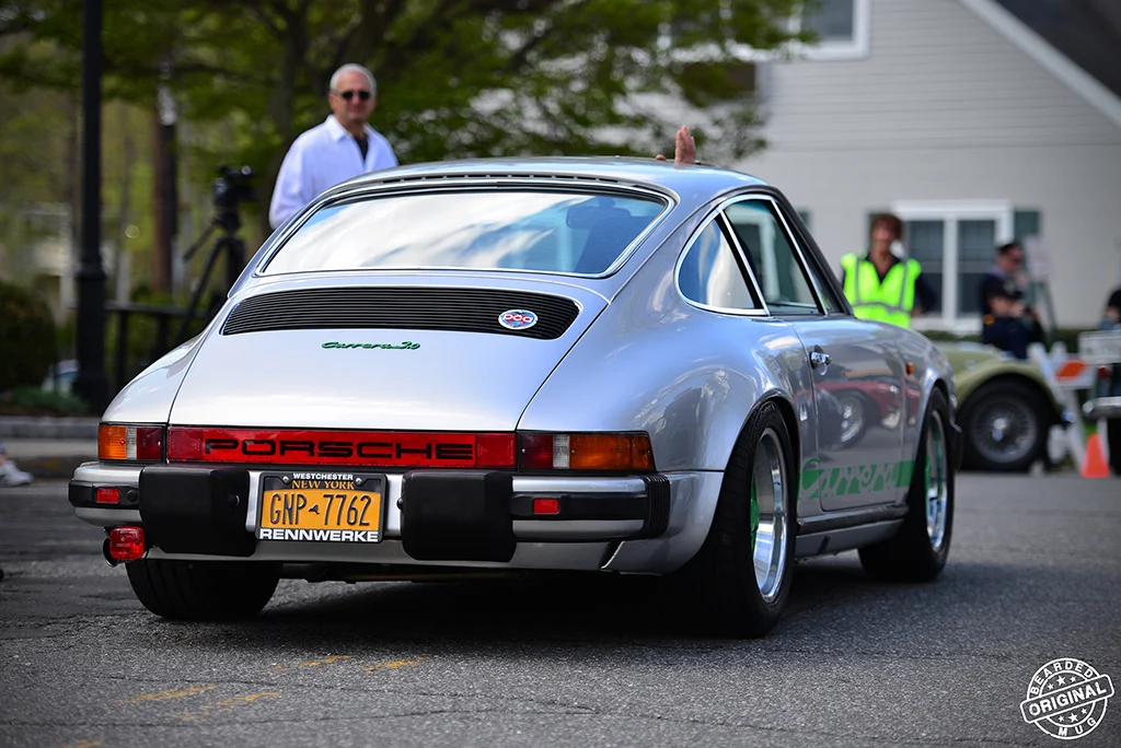 911Carrera3point0silvergreenleaving.jpg