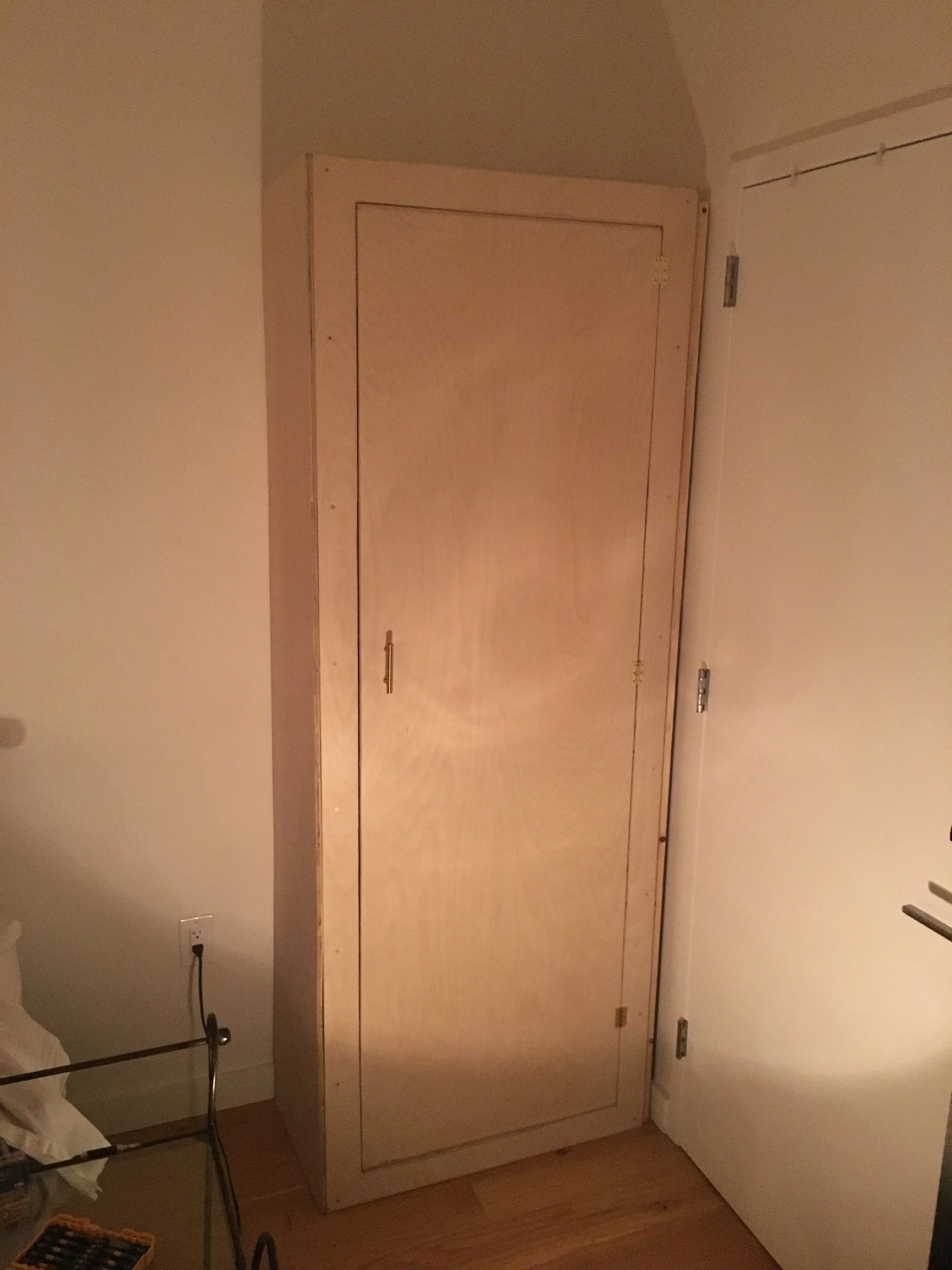   Wall-fixed plywood “armoire”  