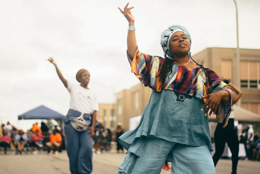 Asadah KIrkland (foreground) from South Shore dances to the musical stylings of DJ Duane Powell at 3YB. Asadah says it’s nice to come to a party that is in the neighborhood.