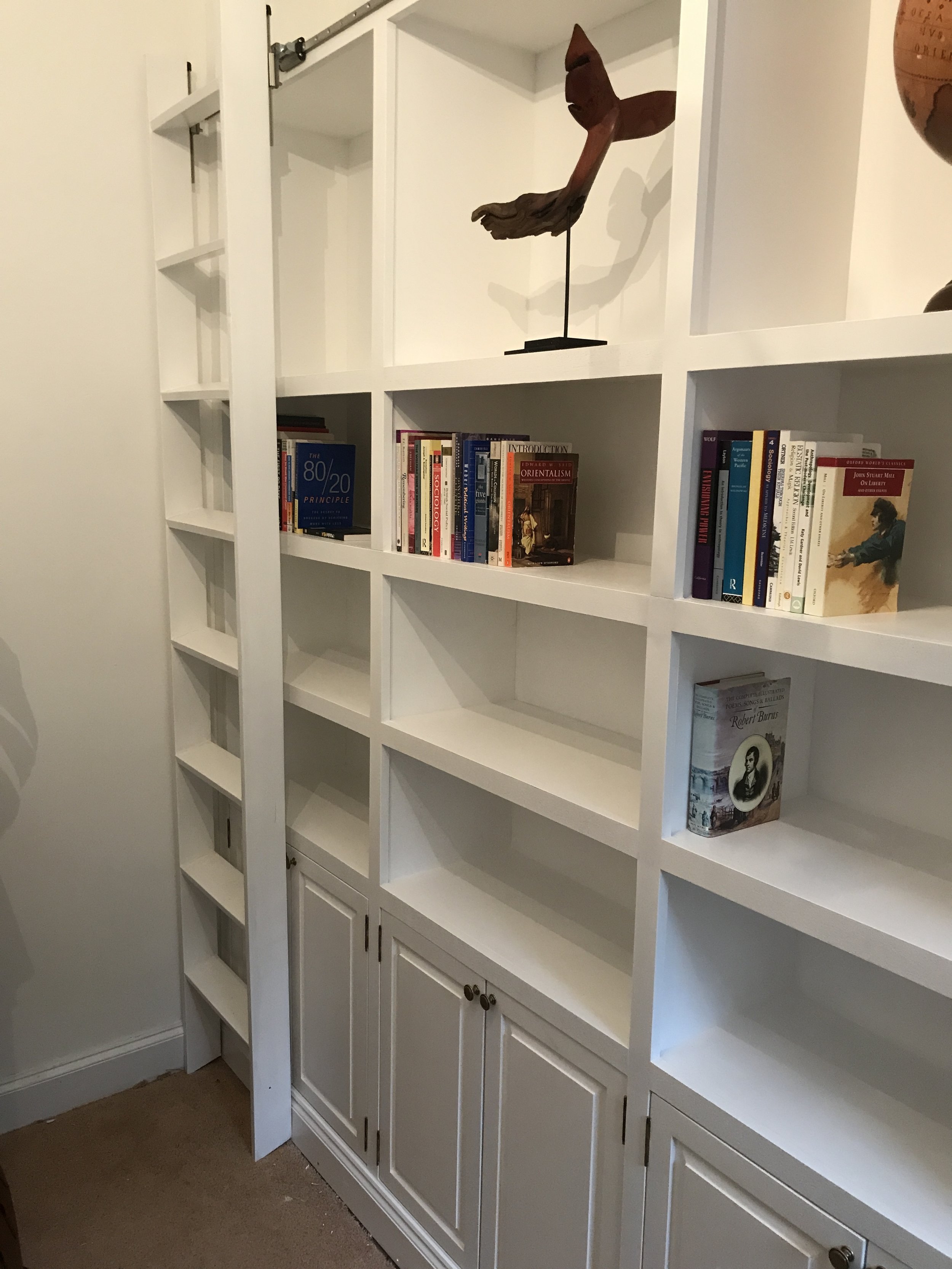 Bookcase with rolling ladder