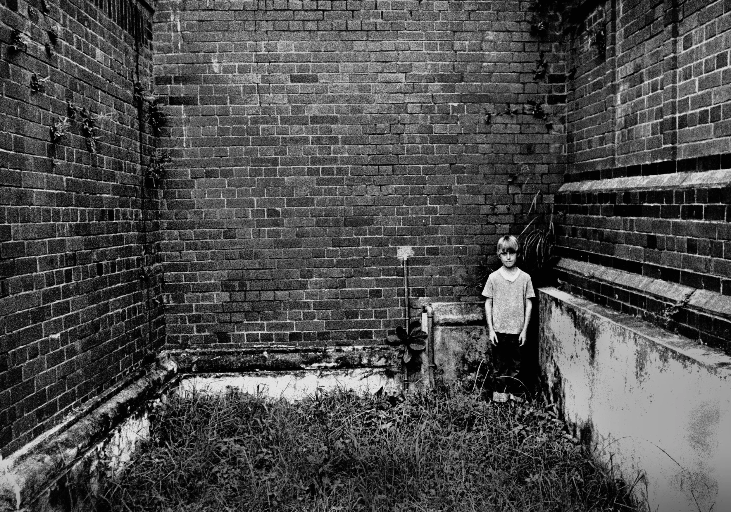 Boy hiding, Durban, South Africa, 1977