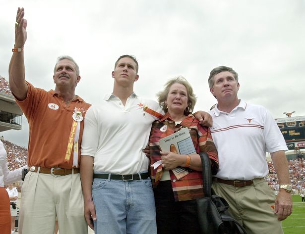 The Pittman family with Coach Brown honoring Cole at a Longhorn game.