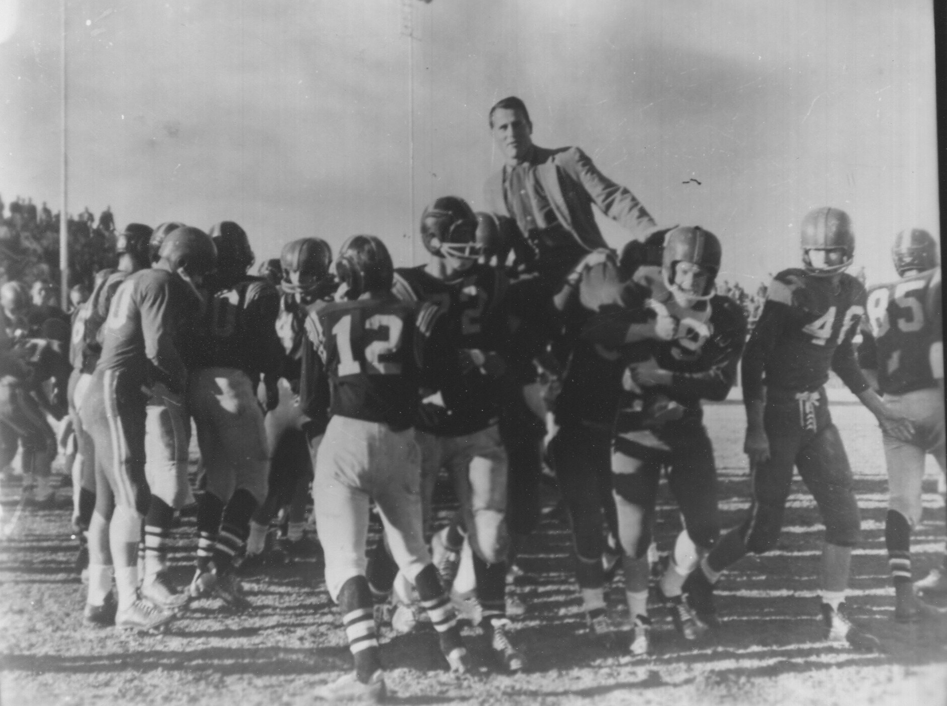  EMORY BELLARD shown being carried off the field after winning his first state title in 1958 in Breckenridge. He would tie for the title at Breckenridge the following year and a few years later win a title at San Angelo. He then went on staff at UT w