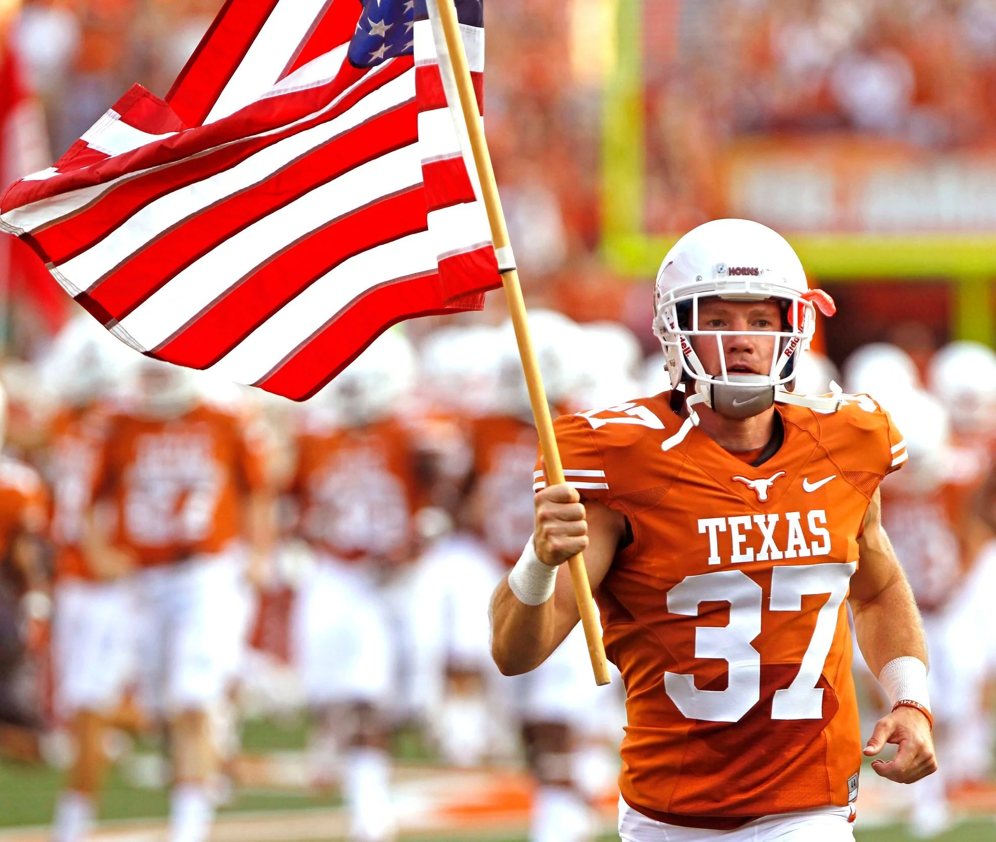 Earl Campbell, Ricky Williams and Jamail Family visit with Football team -  University of Texas Athletics