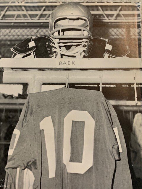  Baer's jersey, hanging in his locker room cage, appeared fittingly as the closing page of the school's yearbook at the conclusion of his senior year. He had starred in track as well as football and helped lead the Vols into the state playoffs in bas