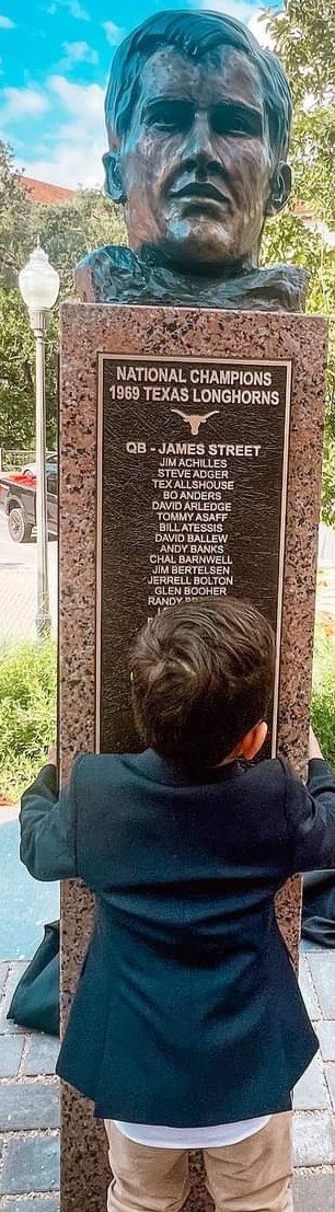  James Streets’ grandson hugs the memory of his grandfather.  