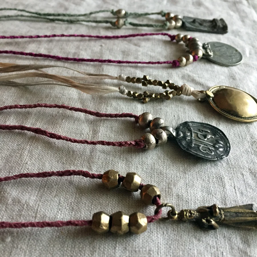 textile jewelry with handmade and vintage amulets by Untold Imprint
