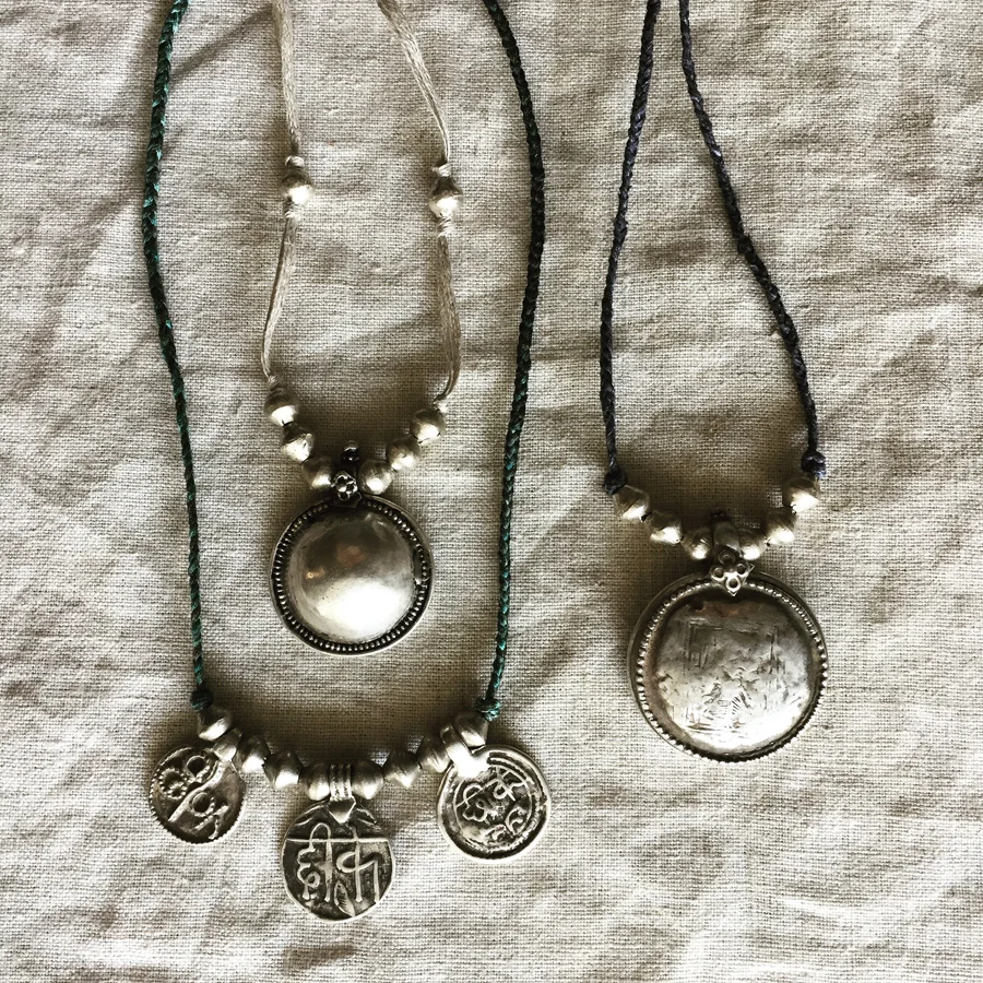 Andali, Three Amulets, & Muse necklaces made with vintage amulets from India on silk & linen.