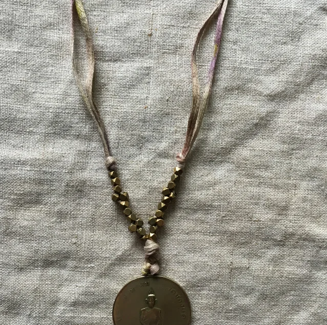 my favorite Thai monk necklace restrung on the cotton taping shown above.