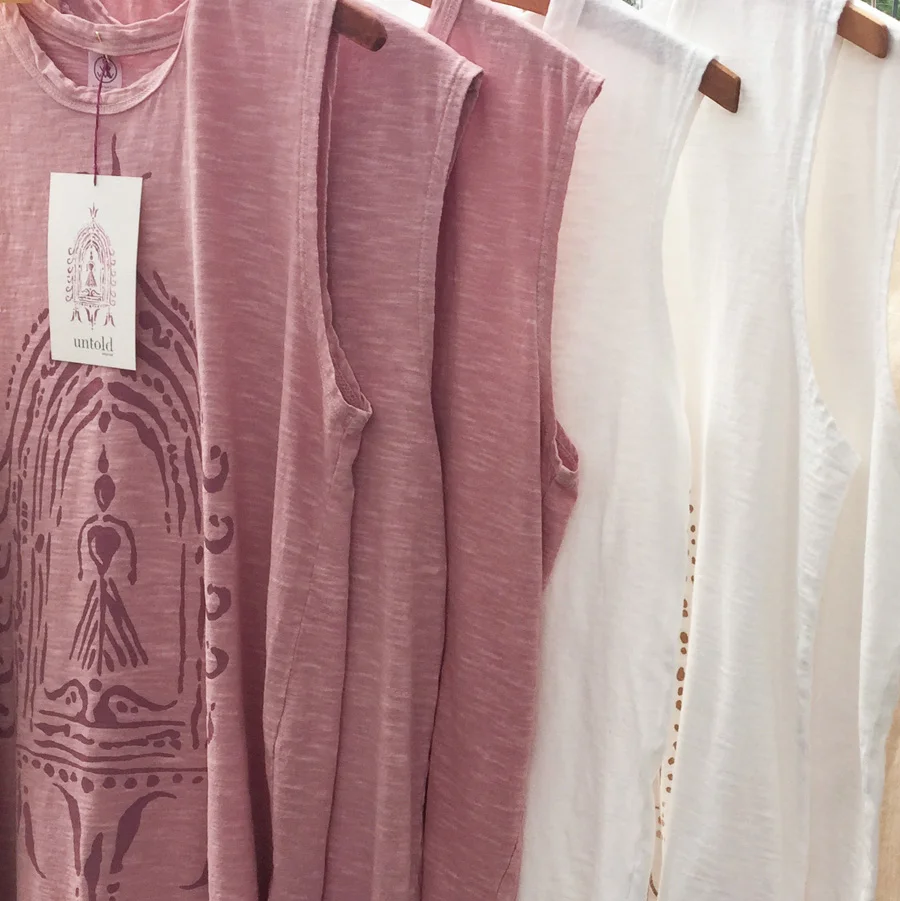 Divine Fem & Buddha print sleeveless tees by Untold Imprint