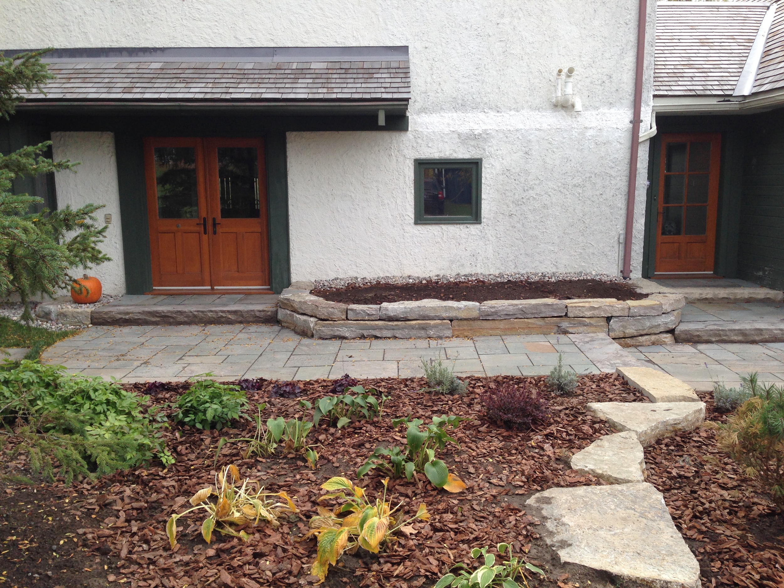  Handstacked natural stone wall using Tackaberry stone. 