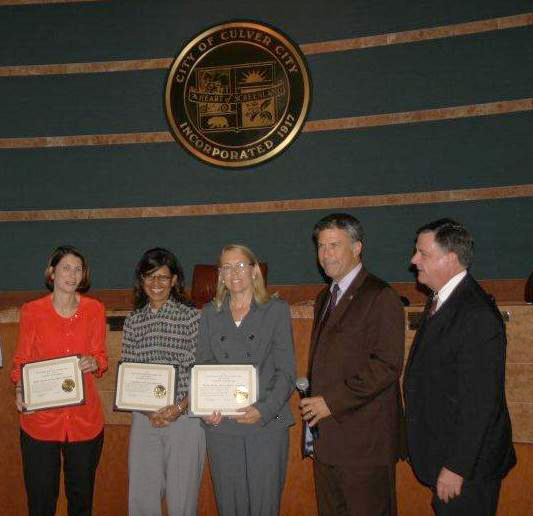 Commissioner-Musicant-and-Board-Member-Christine-Hardin-receiving-Certificates-in-2013-1fixed2.jpg