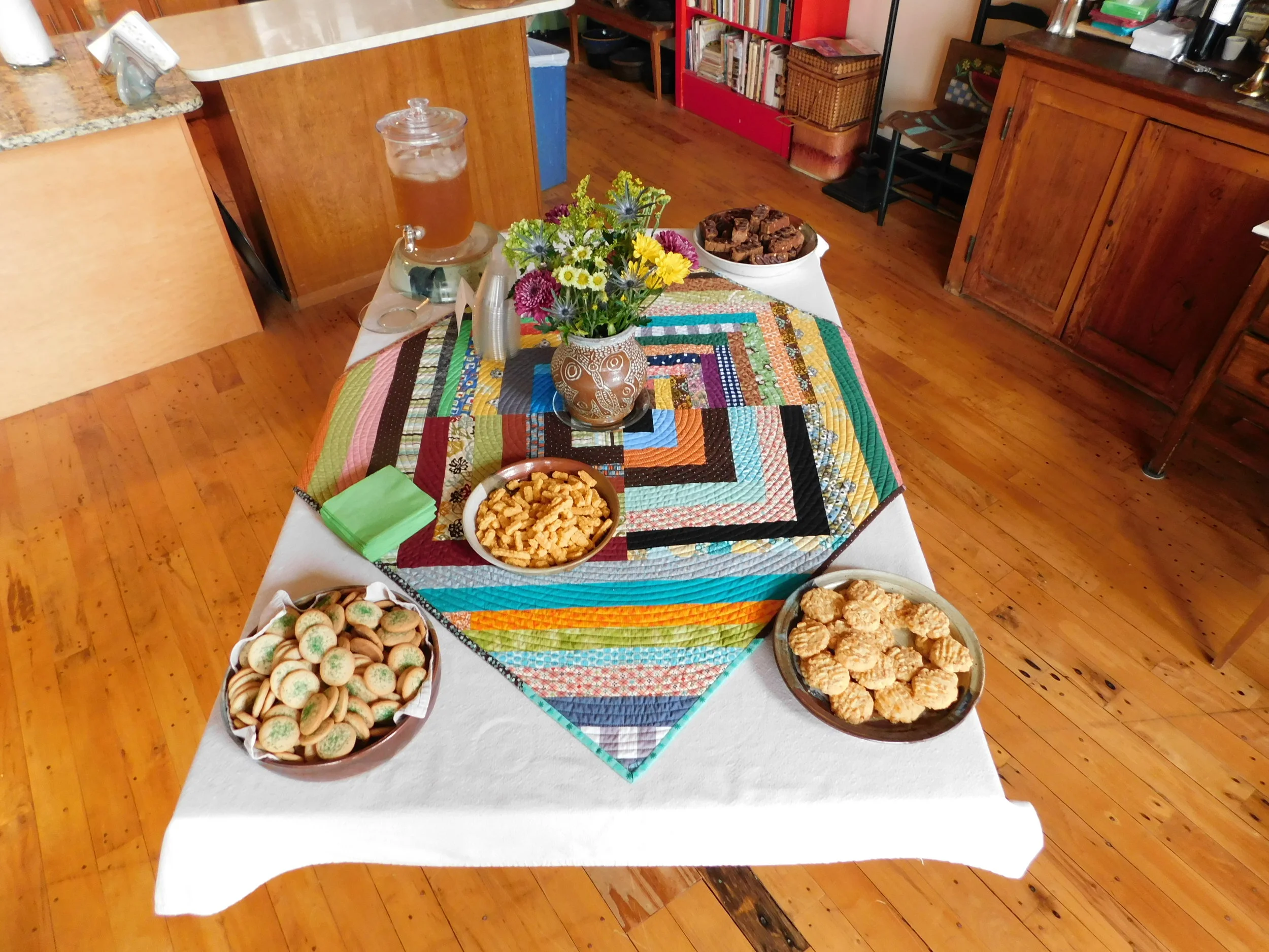 This is the "before" version. As guests arrived bearing offerings, the table became more heavily laden.&nbsp;