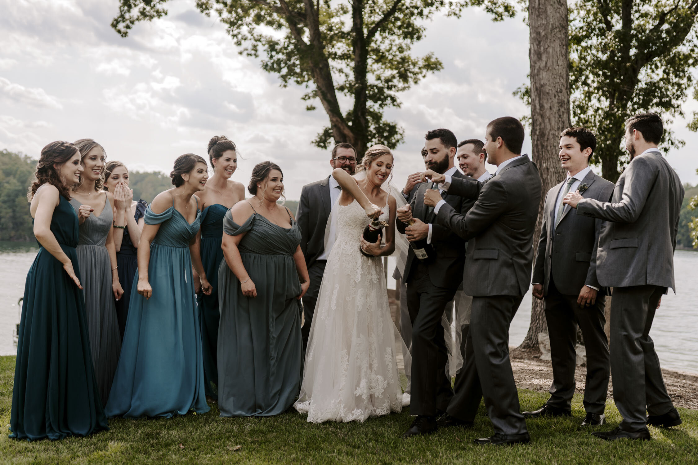 Fun Wedding Party Portraits popping champagne at Bella Collina | By Greensboro, NC Wedding Photographer: Kayli LaFon Photography