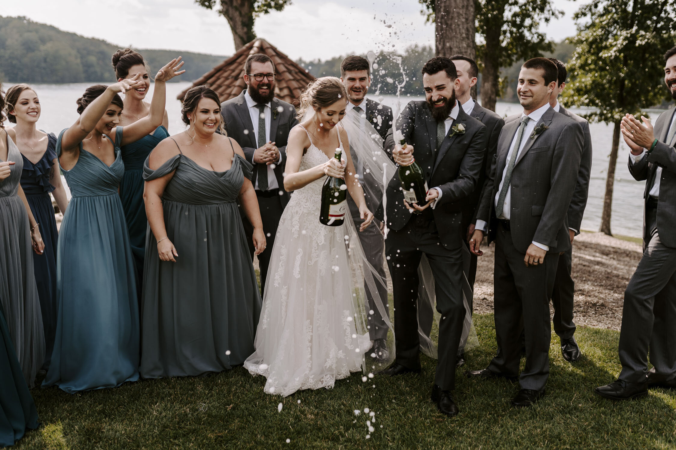 Fun Wedding Party Portraits popping champagne at Bella Collina | By Greensboro, NC Wedding Photographer: Kayli LaFon Photography