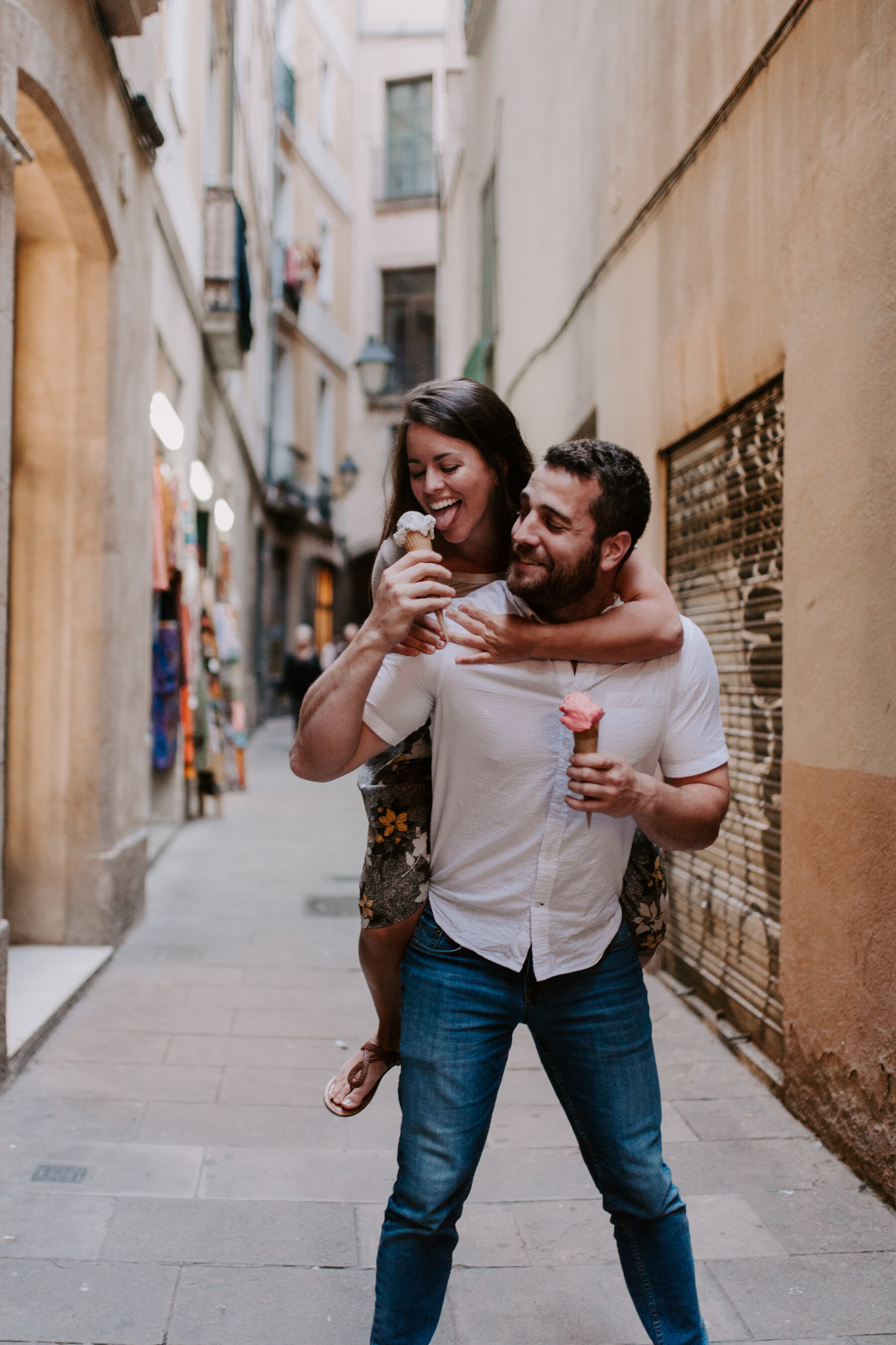 Fun engagement photos eating gelato in Barcelona's Gothic Quarter