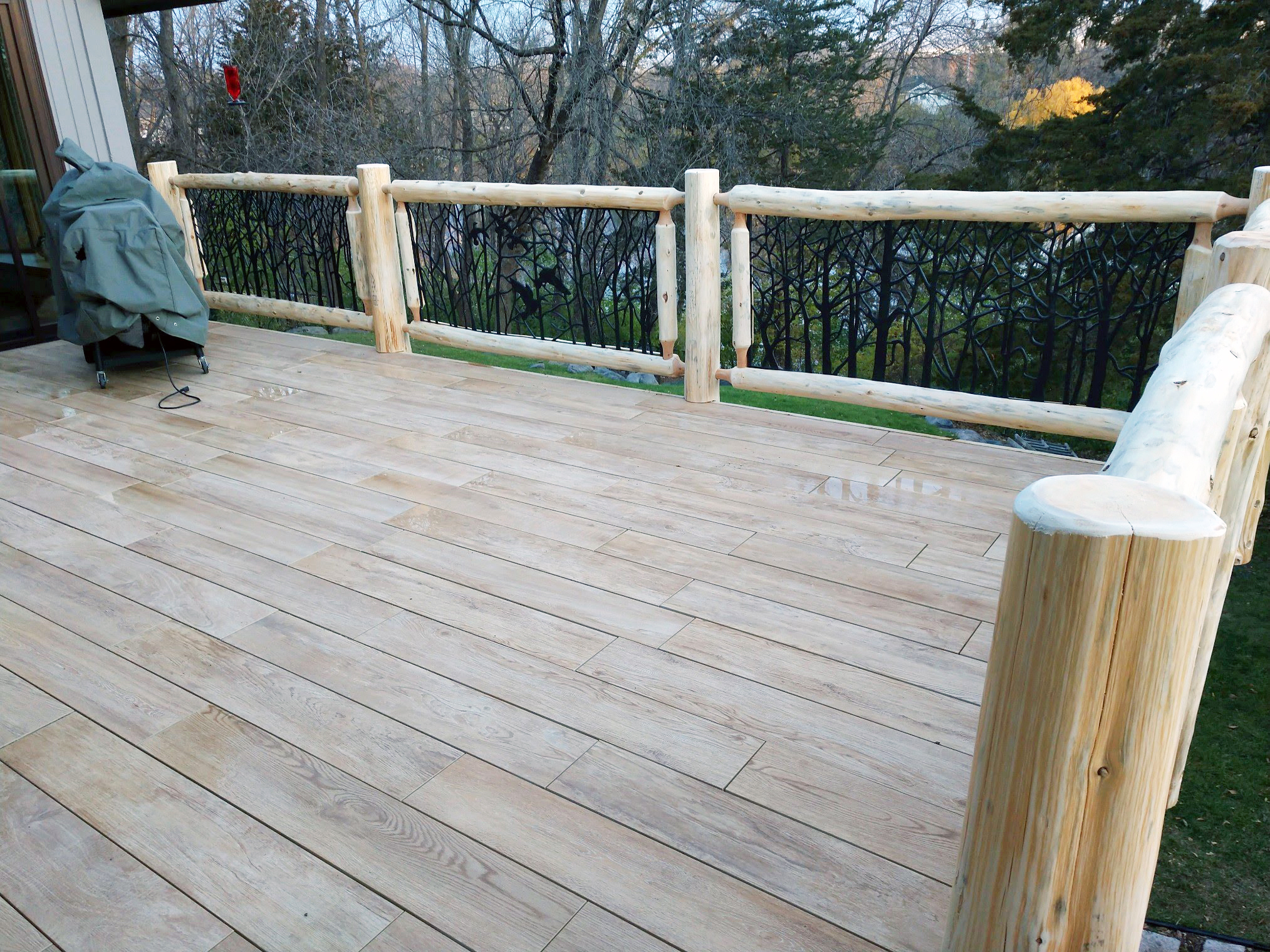 Cedar Log Railing with Decorative Metal Panels by Soderlund's Woodmill in Chisago City, Minnesota