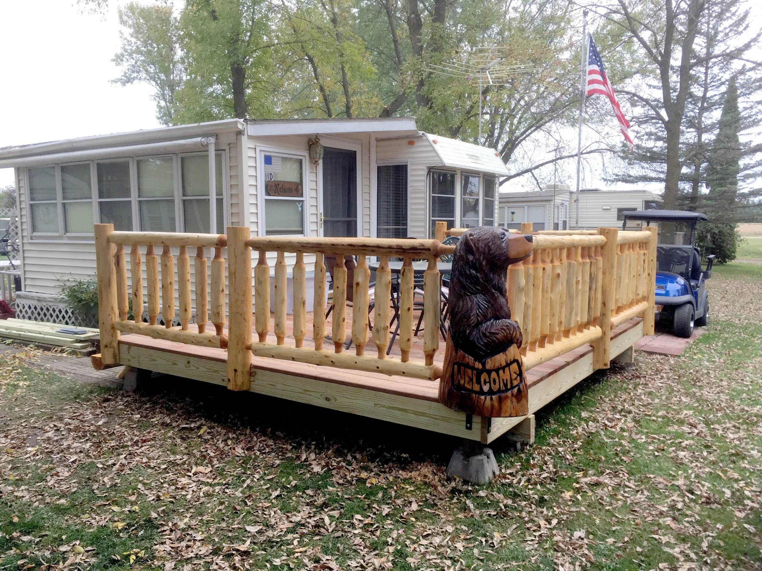 Log+Railing+on+Deck+with+Chainsaw+Carving+Soderlunds+Woodmill+Minnesota.jpg
