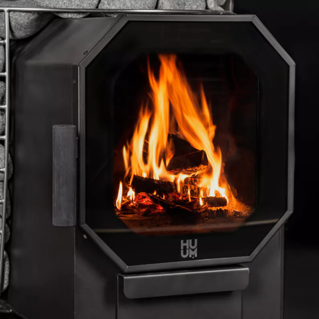 Sauna heater with stones and digital control panel.
