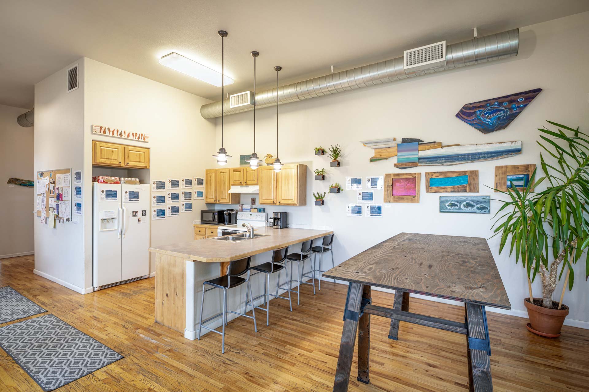 Coworking space kitchen with modern decor.