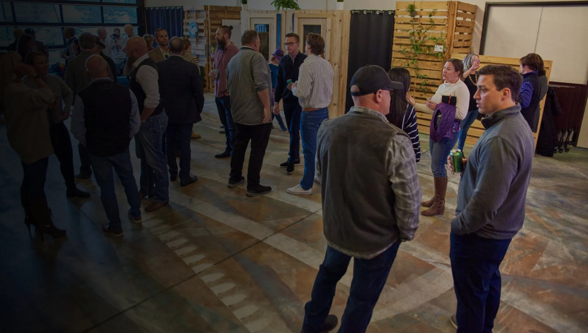 People networking and mingling inside an event space.