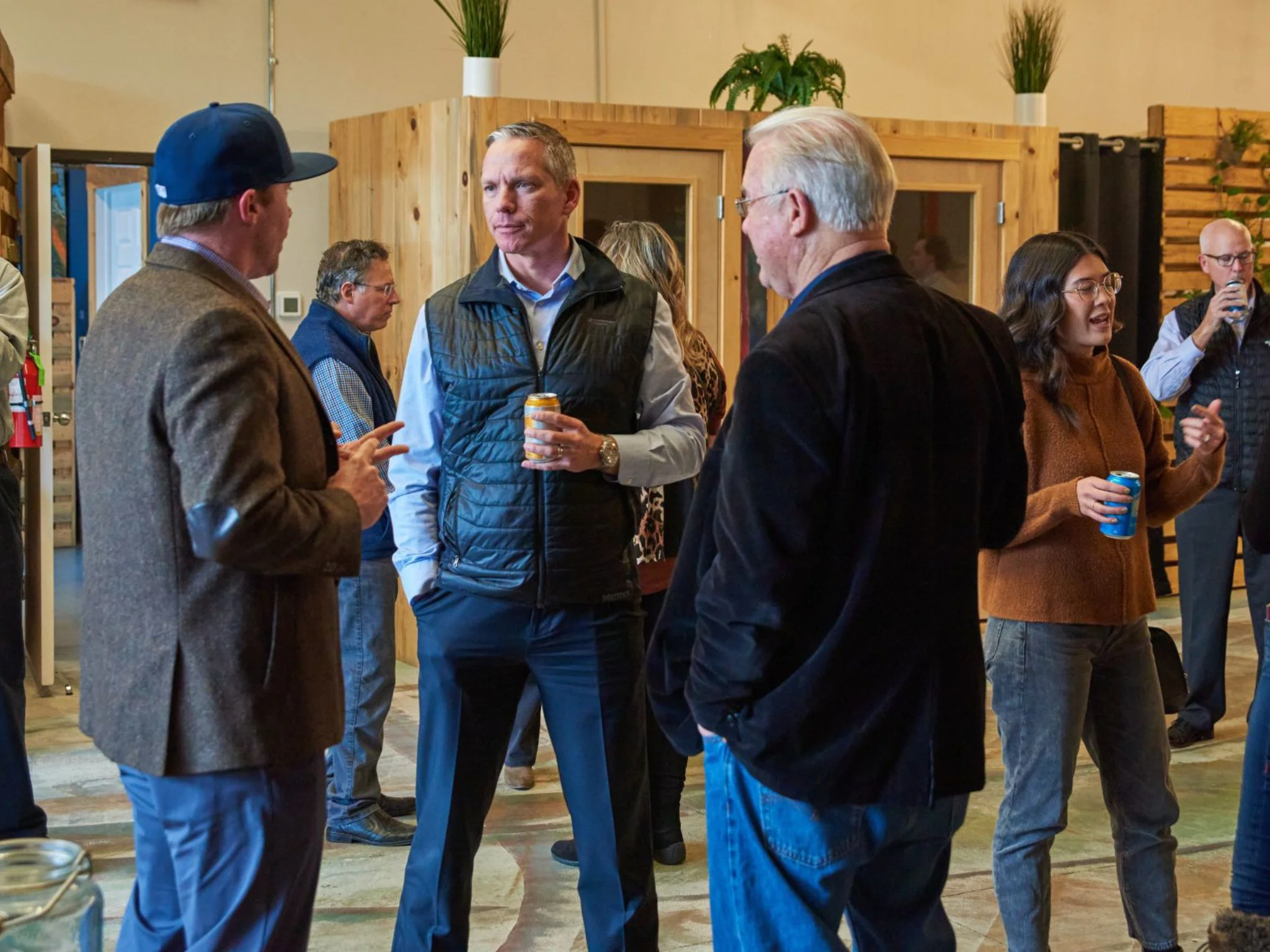 People networking and talking at a coworking event.