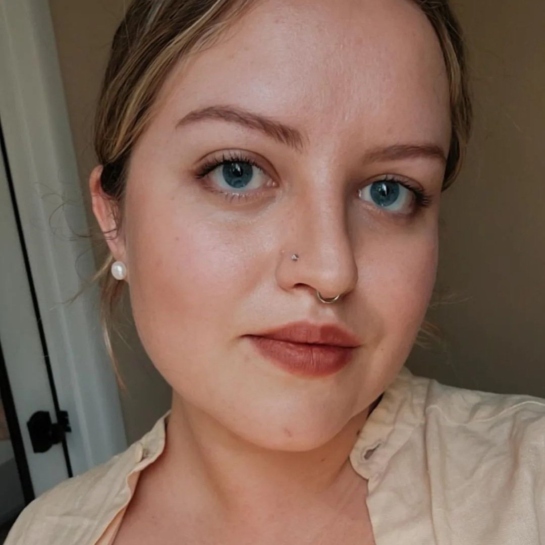Headshot of Maggie Sepeda from the shoulders up smiing directly at camera.