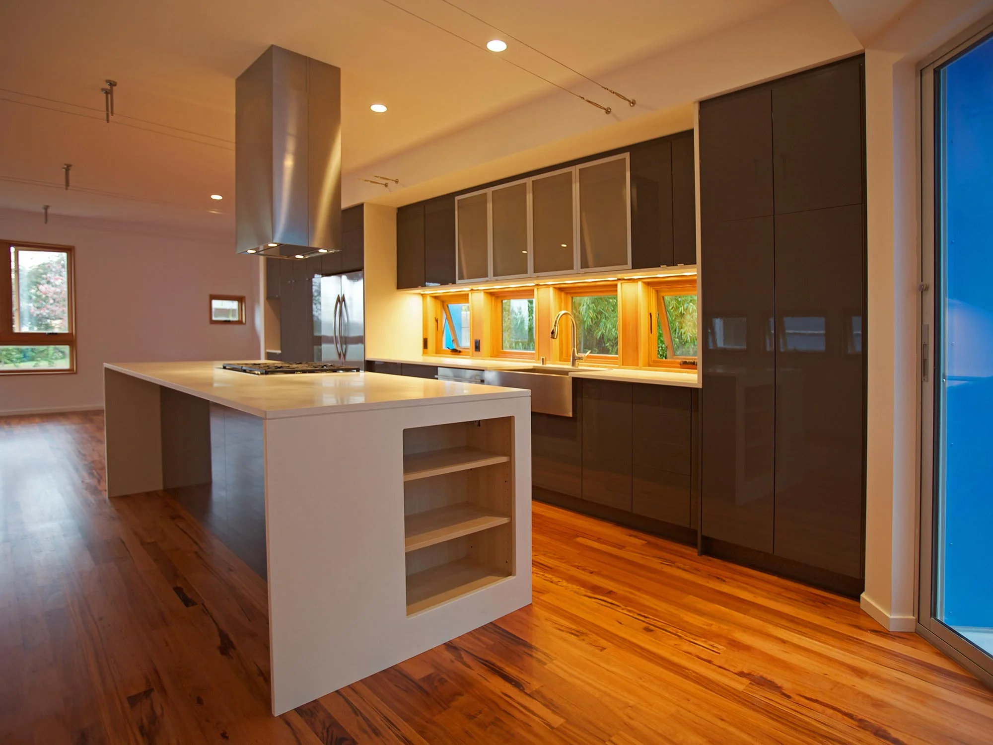 This addition to a 750 s.f. bungalow on one of Seattle’s steepest streets provides three bedrooms and living space at the rear of the site. 