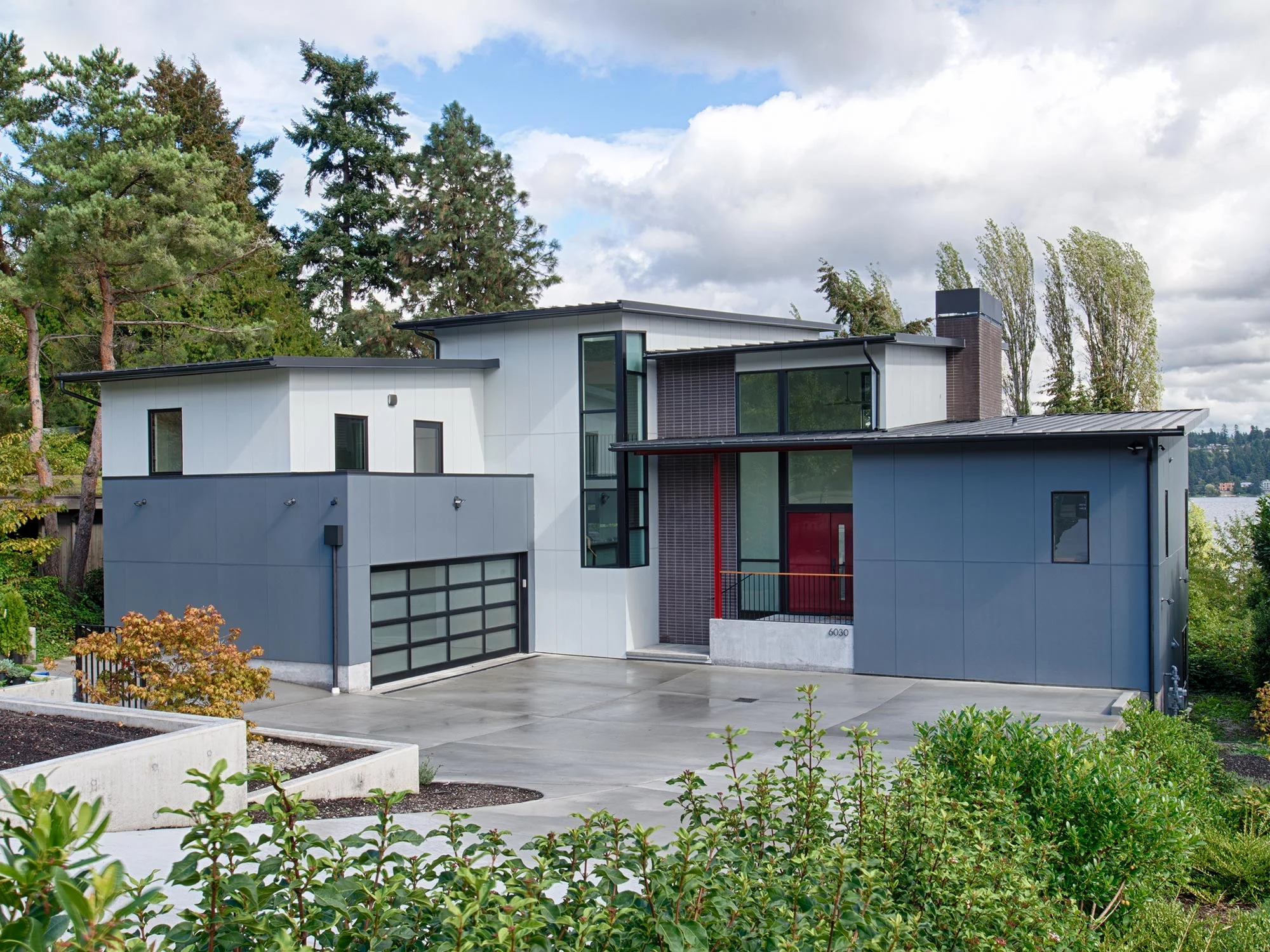 Composed as a series of shed roof volumes which are offset so each major space has full height glass on the southeast corner to frame stunning views of Mt. Rainier across Lake Washington. 