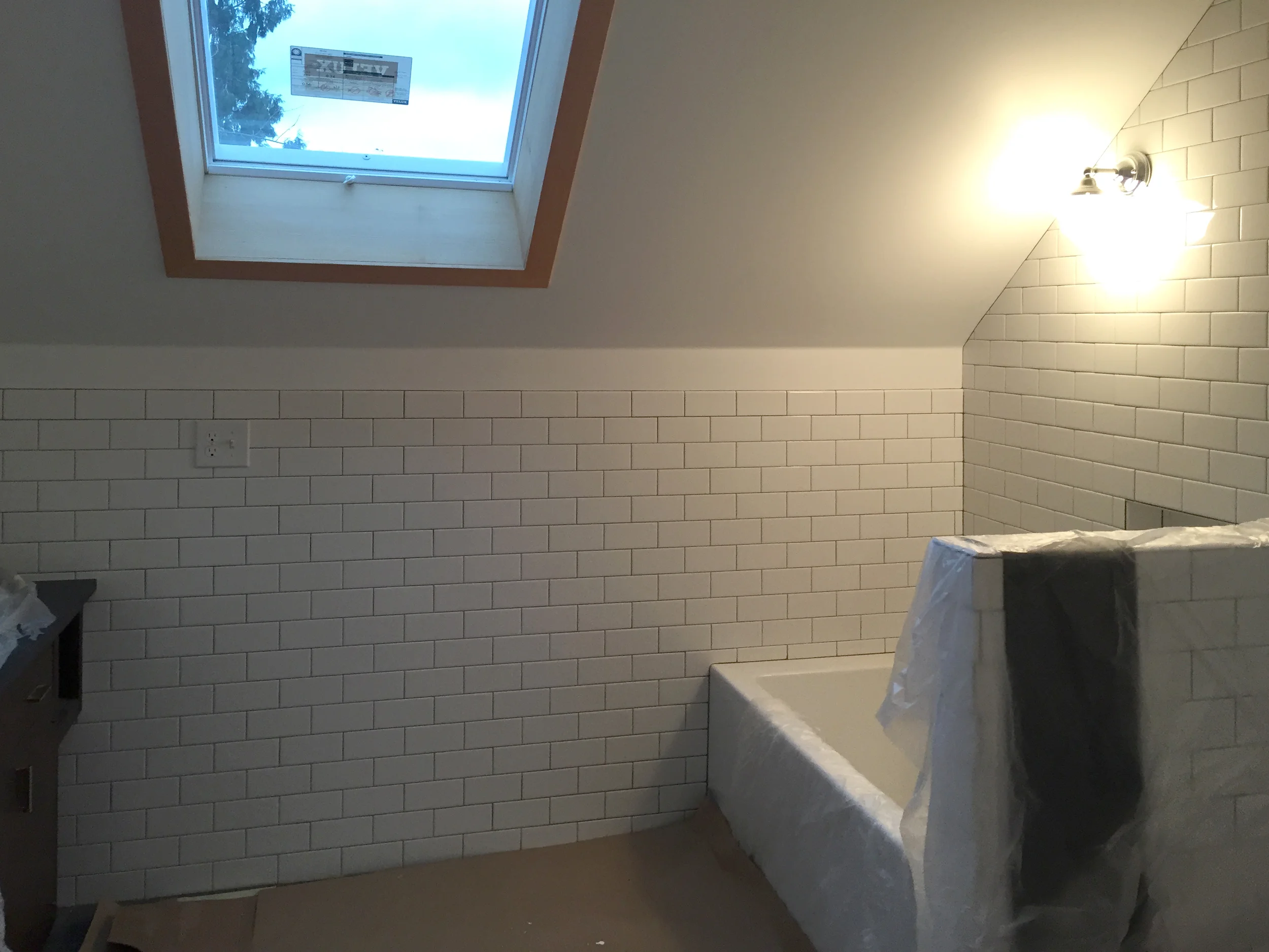 A new bathroom on the second story features a skylight and deep soaking tub.