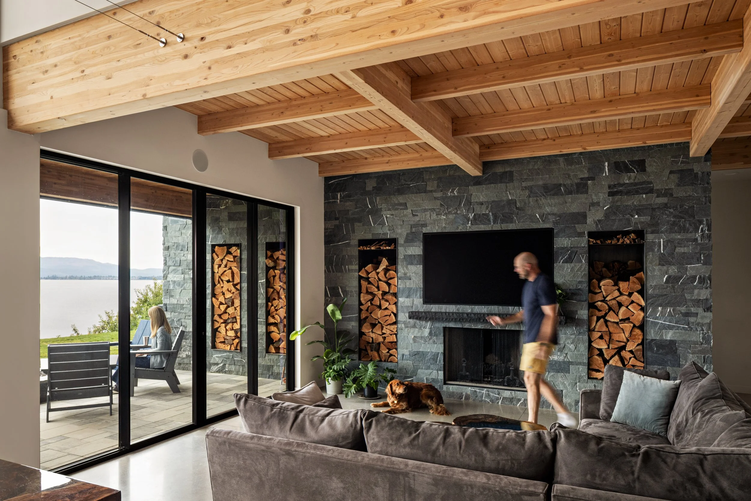 Whisky Jack, living room, fireplace wall, stone, wood storage, lakehouse