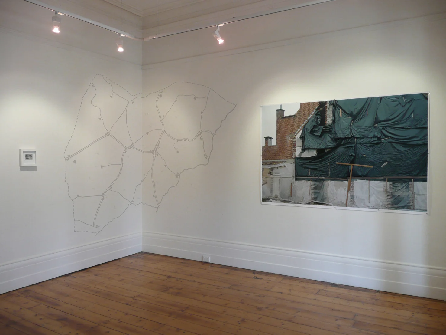 Untitled 2009, chromogenic print 121 x 250 cm; found postcard: Map 2009, pencil wall drawing, dimensions variable installation view, Alliance Francaise de Melbourne