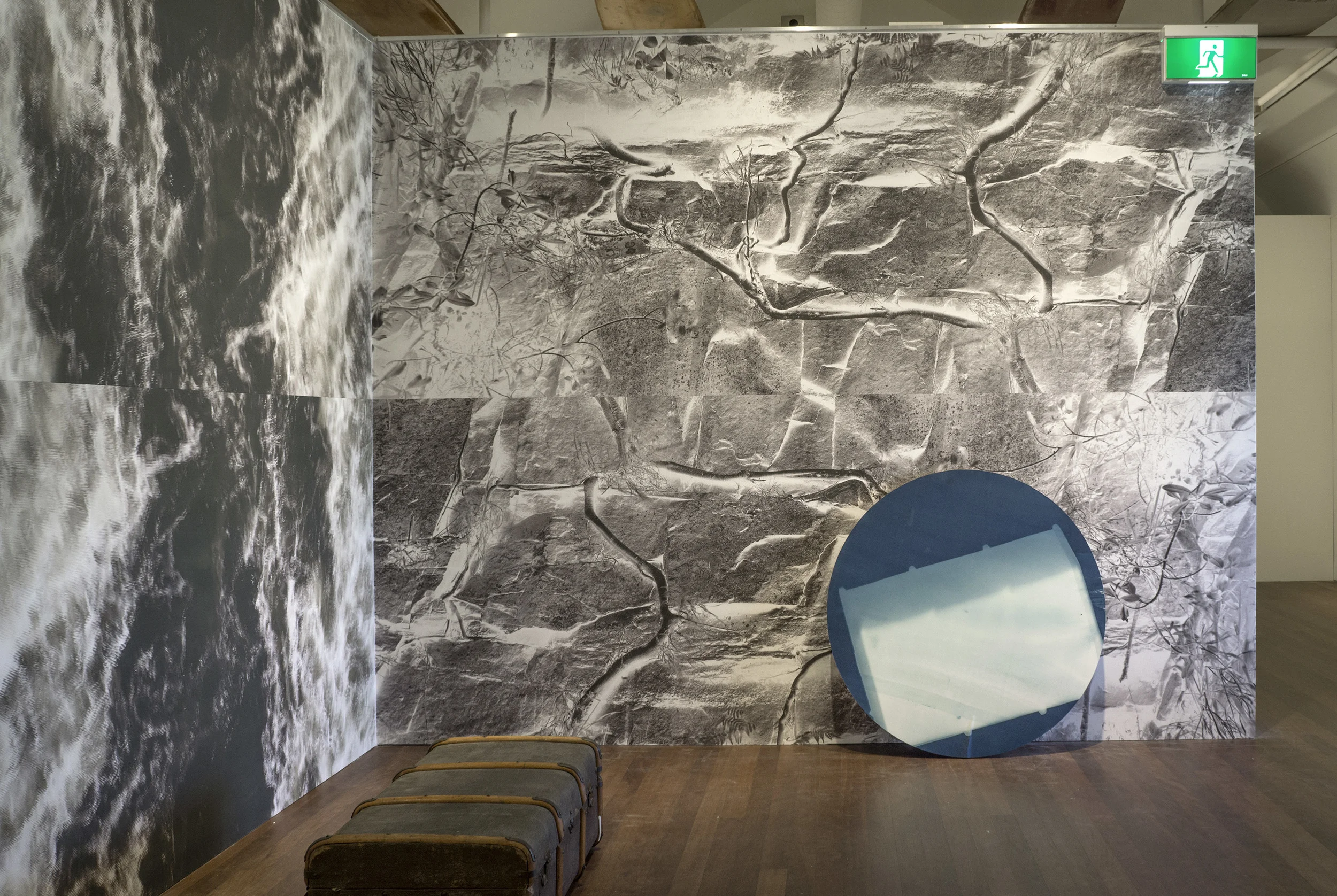 Installation view: Motionless vessel 2015, vinyl wallpaper 282 x 360 cm; Vessel in flux 2015, vinyl wallpaper, 282 x 232 cm; Suitcase 2015, cyanotype print on plywood, 1100mm diameter