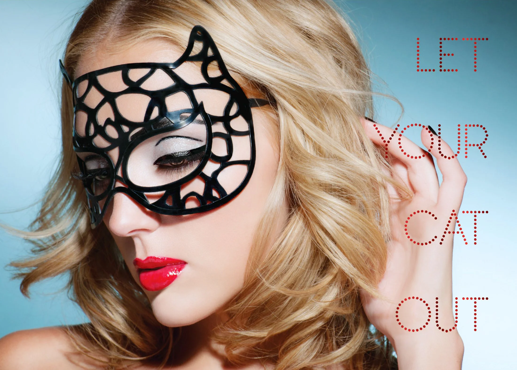 A woman with blonde hair and red lipstick wearing a black masquerade mask, with the text 'LET YOUR CAT OUT' written in red dotted letters on the right side.