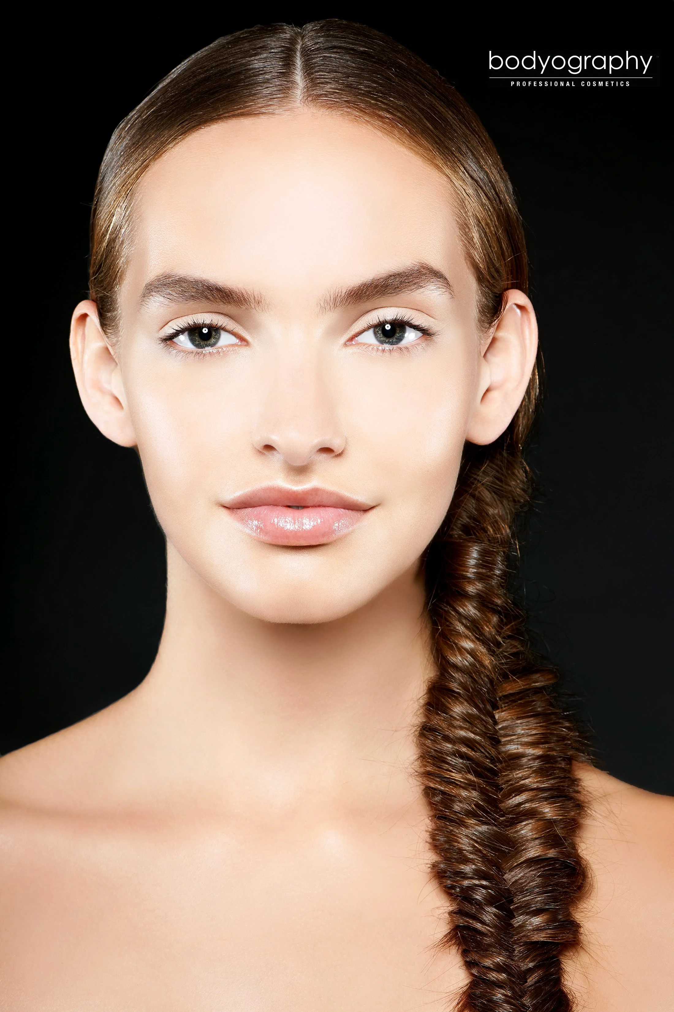 Professional beauty advertising campaign for Bodyography shot by Daniella Hehmann, featuring precise rim lighting that accentuates metallic eye makeup and a satin skin finish. Expert beauty photographer in Los Angeles and Munich specializing in high-